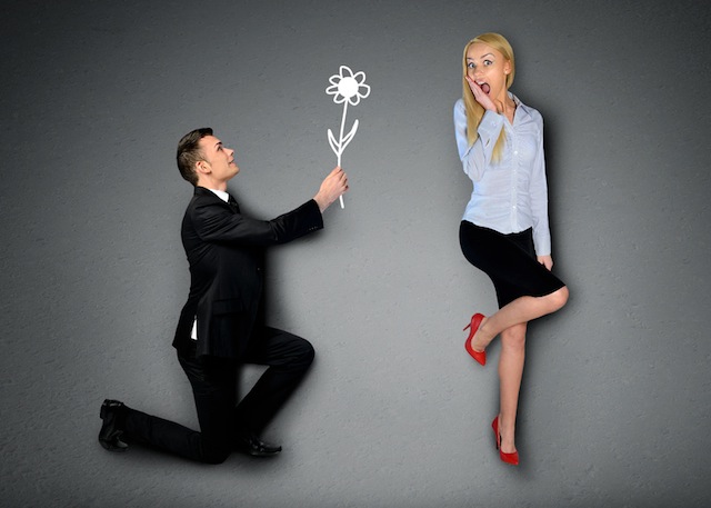 Business man giving flower